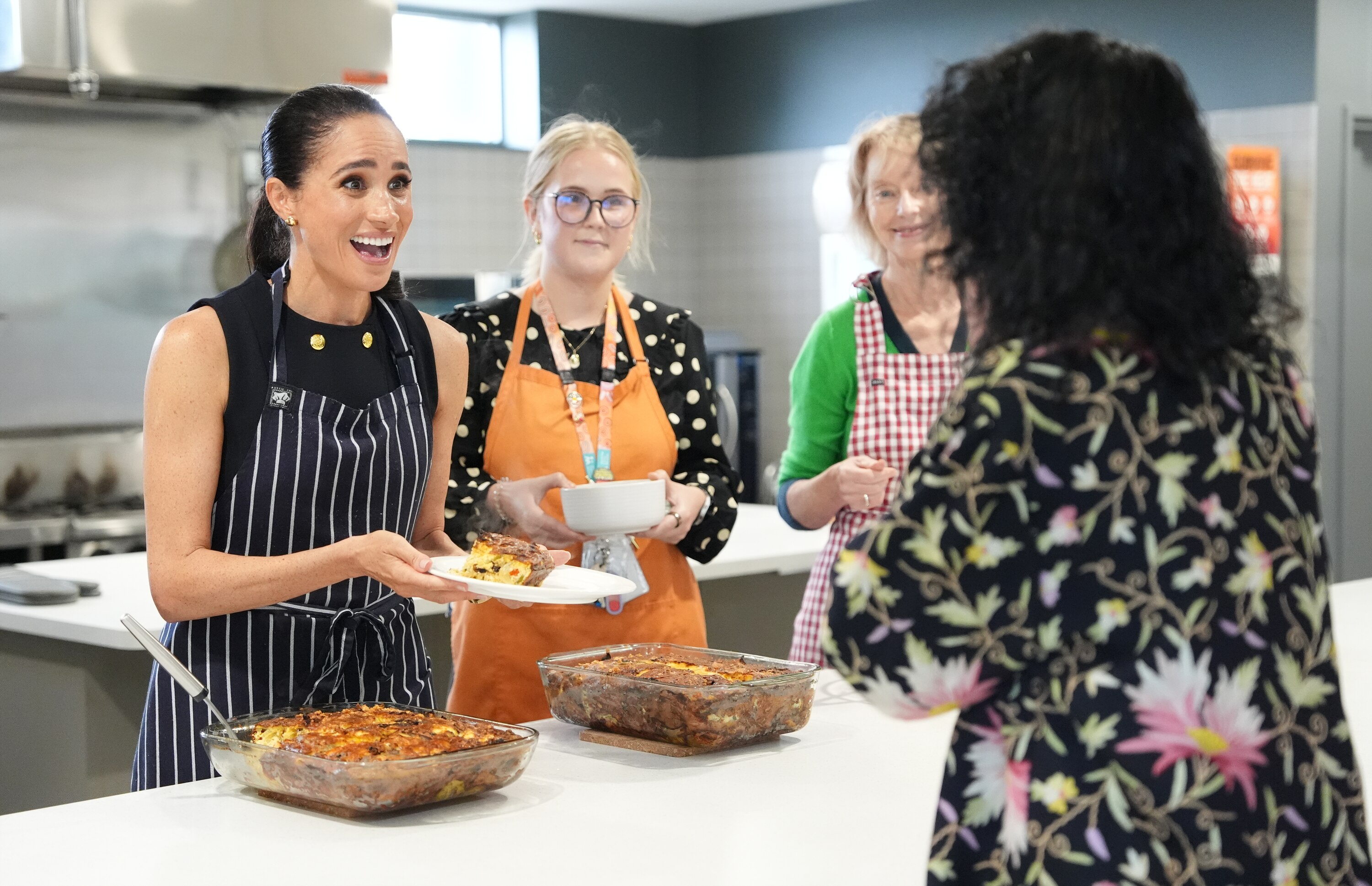 Meghan Markle serving lunch