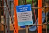 Park closed sign on playground equipment at Ken Fletcher Park at Tennyson in Brisbane.