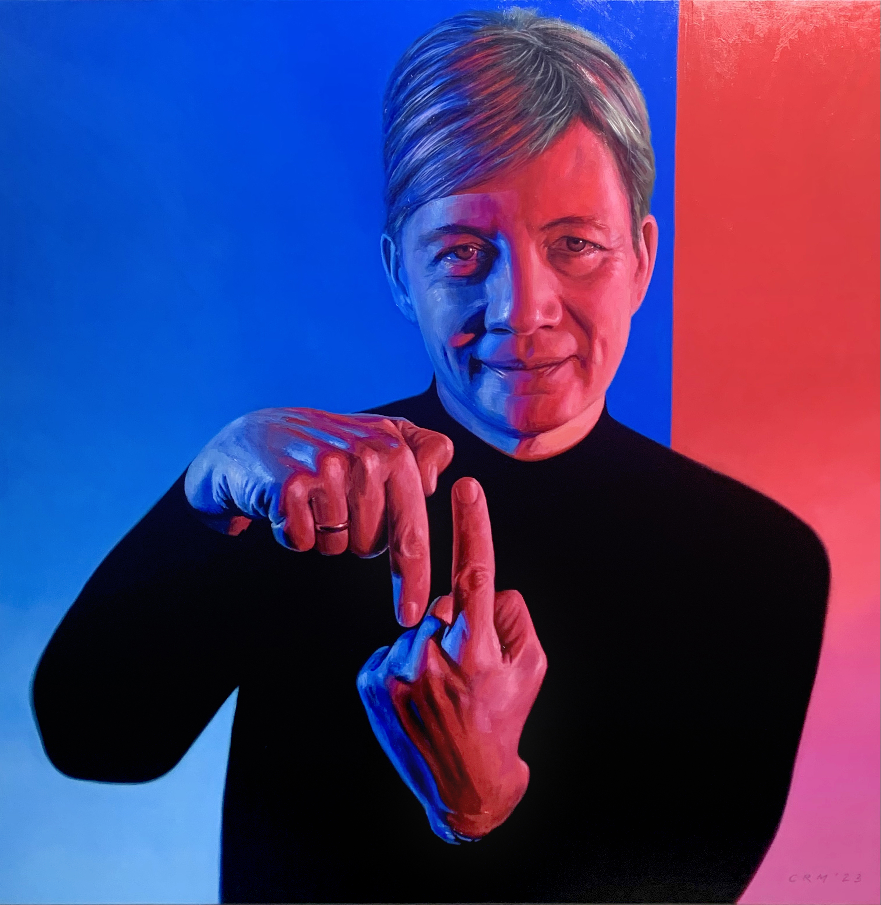 A portrait of Michelle Simmons. She is pointing one index finger up and the other index finger down