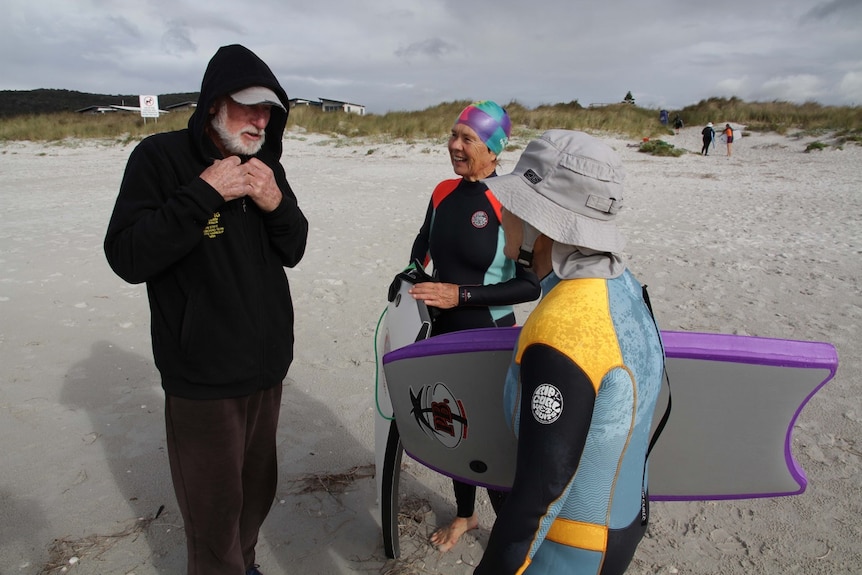 Surf instructor Tony Harrison with surfers in Albany