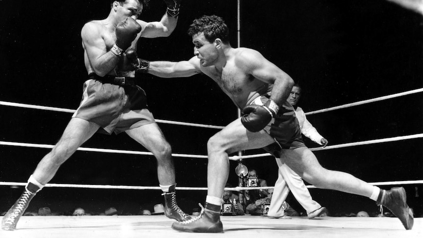 A 1949 photo of Jake LaMotta fighting in the ring.