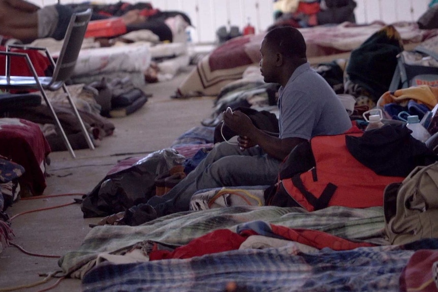 Rows of mattresses and blankets where Haitian migrants have been sleeping on the floor of this Tijuana church. 