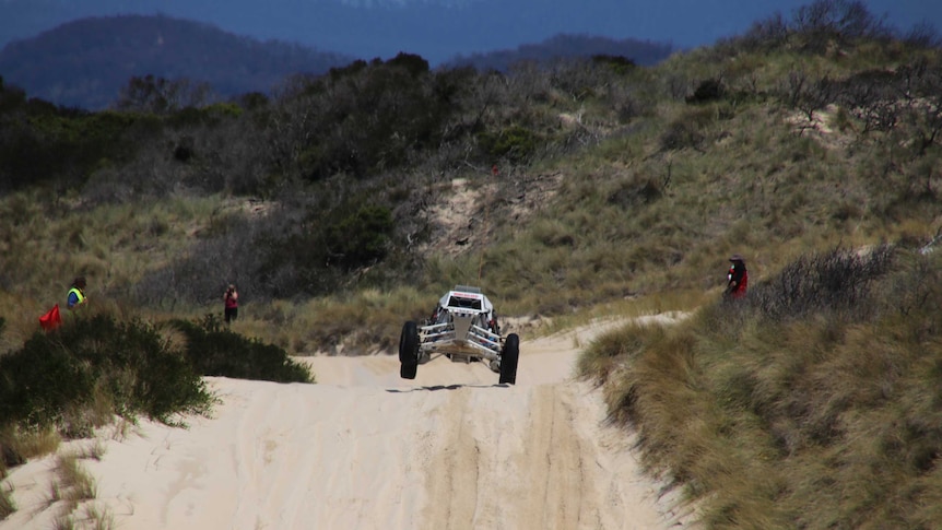 Scott Rockliff launches his dune buggy.