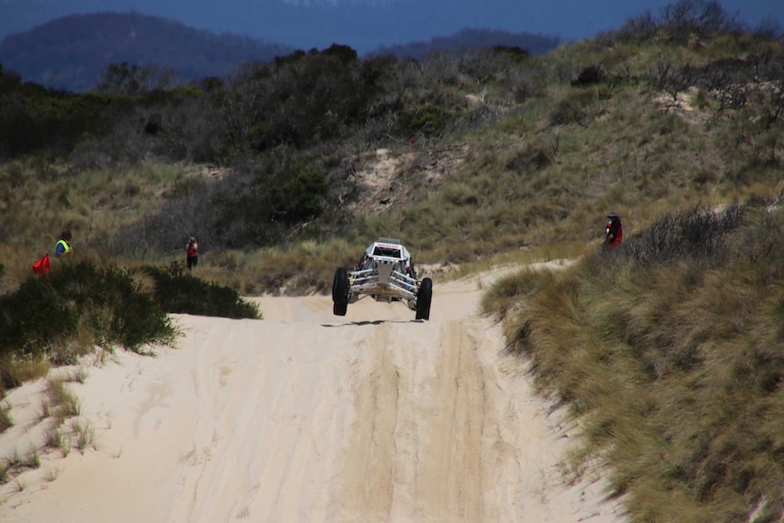 Scott Rockliff launches his dune buggy.