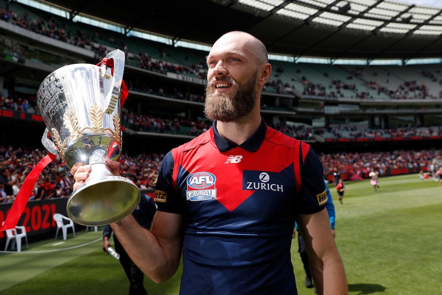 Max Gawn of the Demons raises the AFL Premiership trophy during the Melbourne Demons' post-flag Celebration