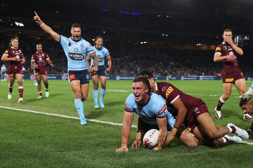 Jack Wighton of the NSW Blues shouts as scores a State of Origin try against Queensland Maroons.