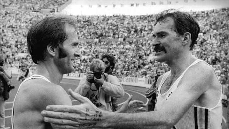 Rob De Castella with East Germany's double Olympic champion Waldemar Cierpinski in 1983.