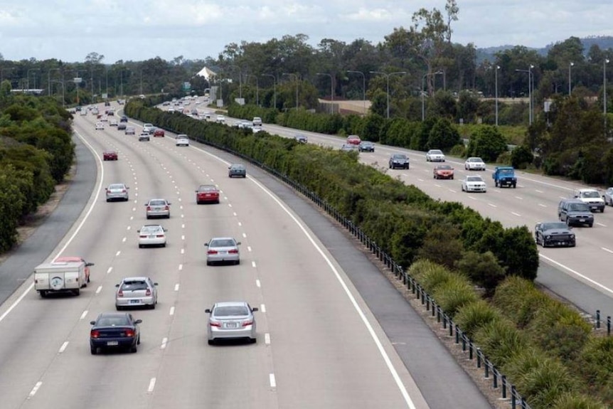 Cars driving on the Pacific Motorway.