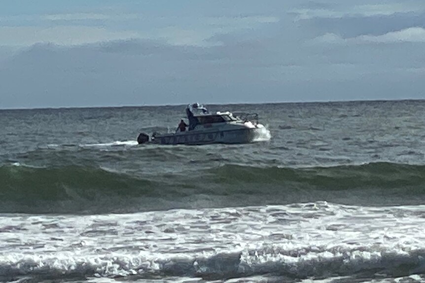 A police boat searching at Surfers Paradise