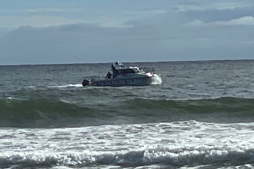 A police boat searching at Surfers Paradise