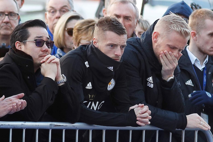 Sad looking Aiyawatt, Jamie Vardy and Kasper Schmeichel