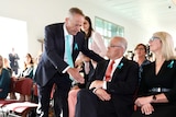 Bill Shorten extends his hand to the PM to shake. Morrison just looks at it.