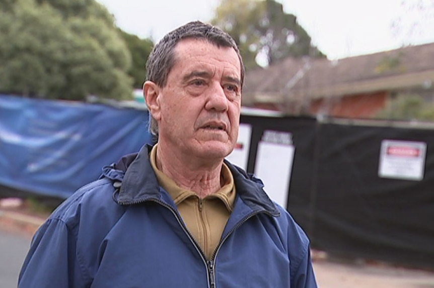 Leo Carvalho in front of the Mr Fluffy home he blockaded.