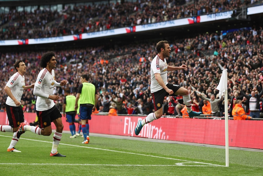 Manchester United's Juan Mata (R) celebrates his goal against Crystal Palace in the FA Cup final.