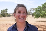 Portrait photo of Jemma Brown in field.