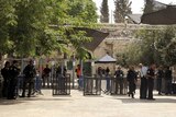 Israeli border police officers stand near newly installed cameras at the entrance to the Al Aqsa Mosque.