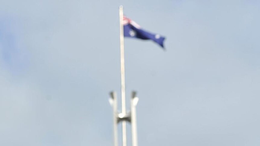 Prime Minister Julia Gillard listens to former prime minister Bob Hawke as he speaks