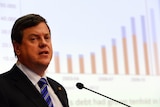 Mr Nicholls addresses the media before officially handing down the state budget in Brisbane.