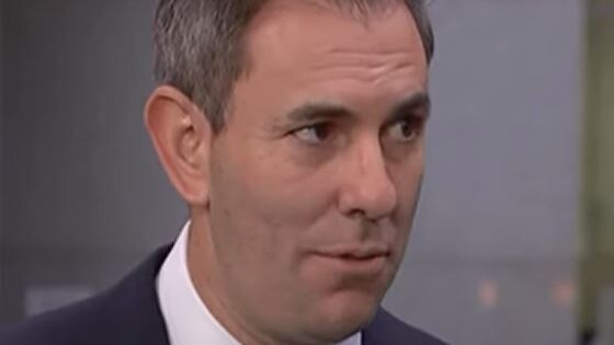 Close up of man in suit talking on camera