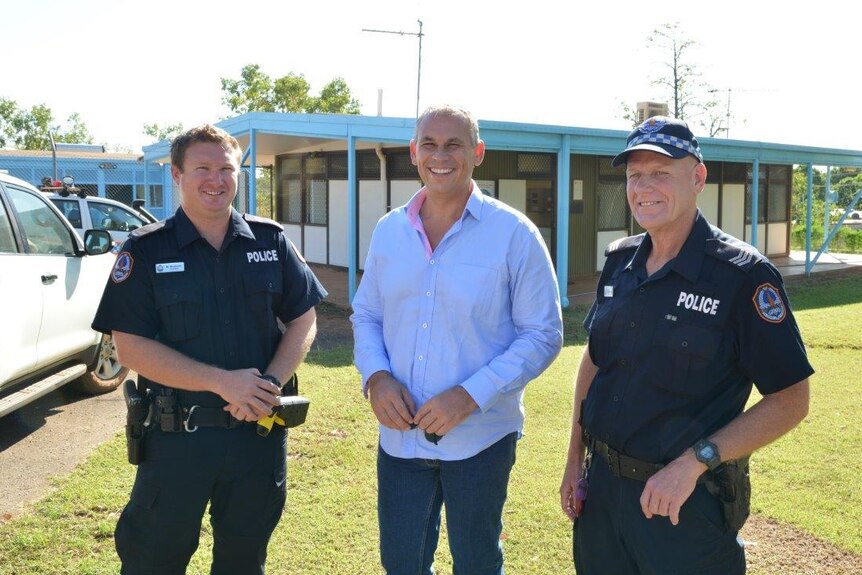 Officers Matthew Woldseth and Trevor Bates at Ngukurr police station with Adam Giles.