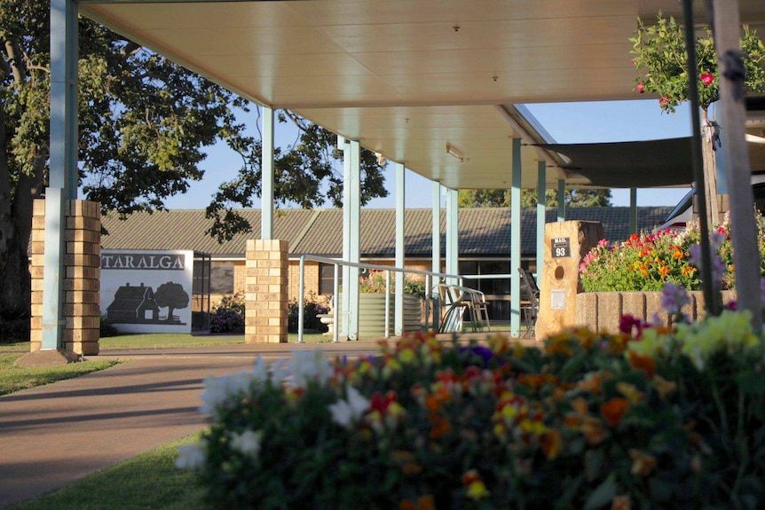 A photo featuring the gardens and a covered walkway at Taralga Retirement Village at Jandowae, Queensland.
