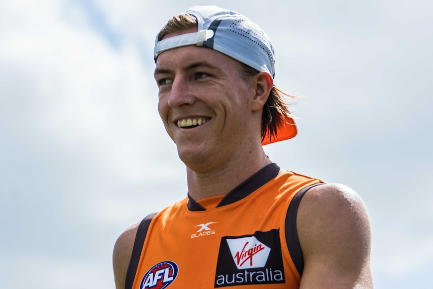 A mid-shot of a smiling GWS Giants player Will Setterfield.