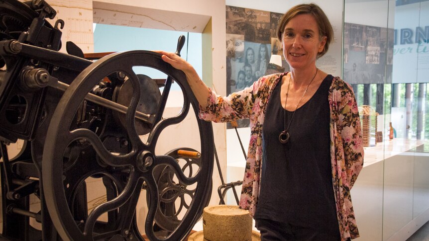 Woman with old wheel