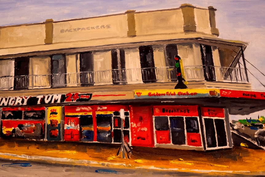 A painting of a building with a sign saying Hungry Tum over the front of it.