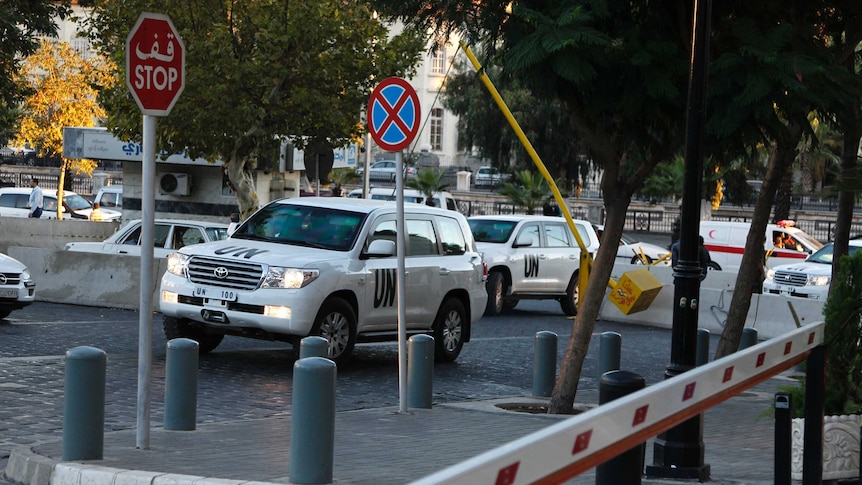 UN vehicles transport experts set to destroy Syria's chemical weapons