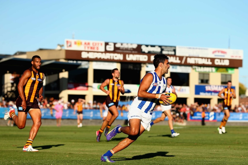 Lindsay Thomas on the ball for North Melbourne