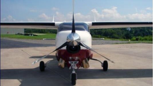 A light aircraft in an airfield.