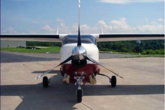 A light aircraft in an airfield.