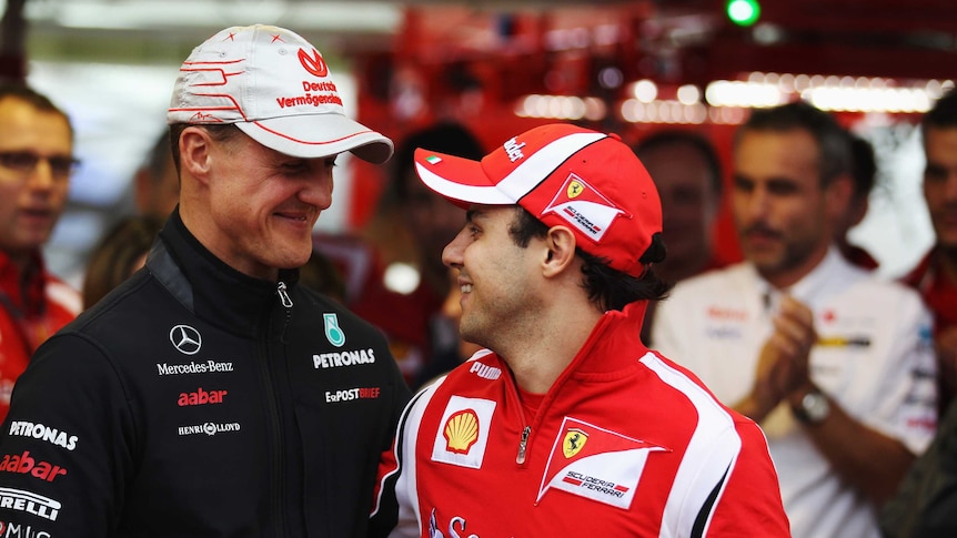 Felipe Massa and Michael Schumacher file pic