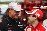 Felipe Massa and Michael Schumacher file pic