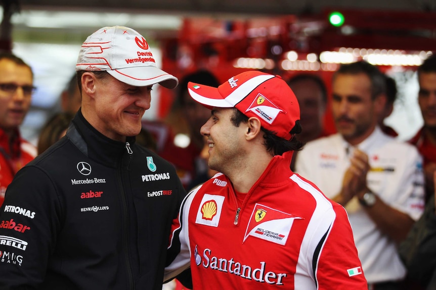 Felipe Massa and Michael Schumacher file pic