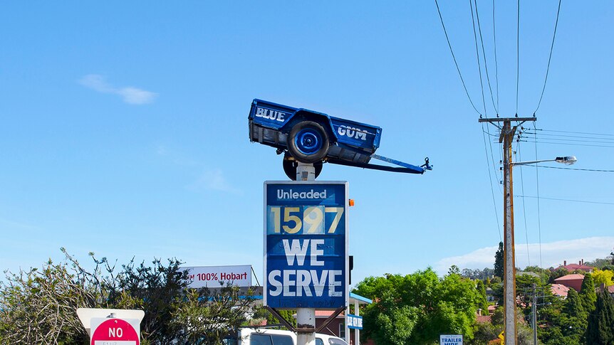 A trailer transformed into a sign at a service station in Newtown.