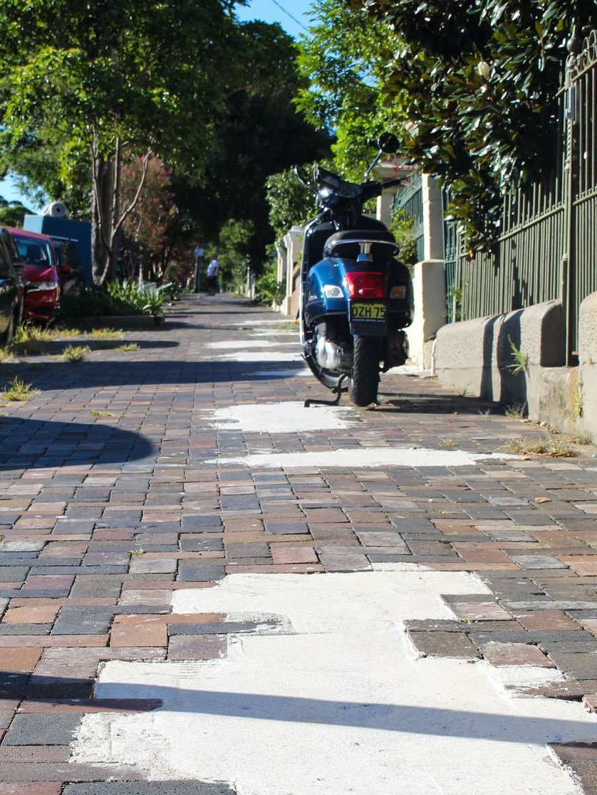 Heritage-listed footpath along Juliett Street in Marrickville showing the repair marks after NBN installation.