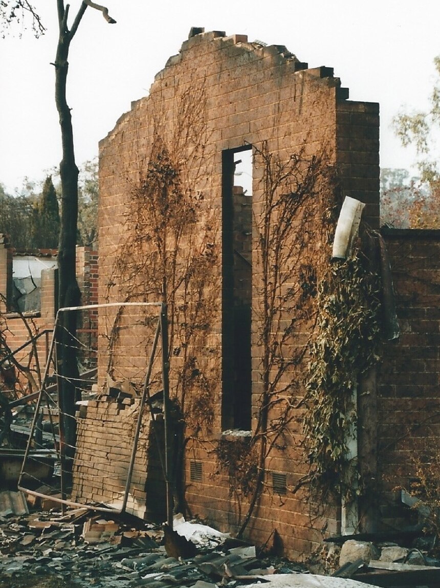 Shell of Natalie Larkins home after Canberra bushfires 2003