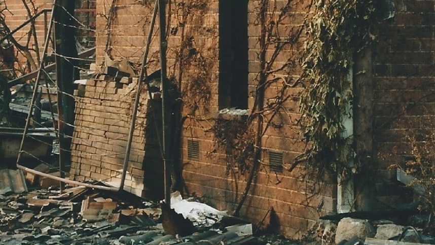 Shell of Natalie Larkins home after Canberra bushfires 2003