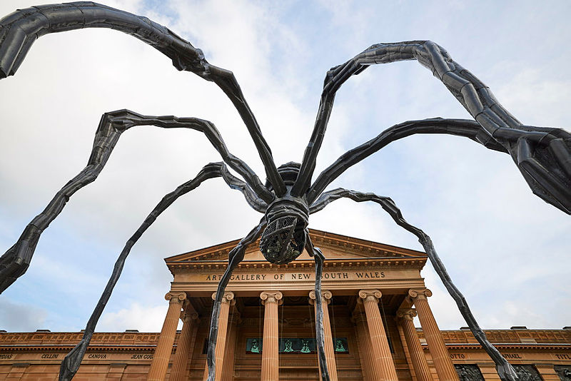Giant sculpture of a spider in front of an art gallery.