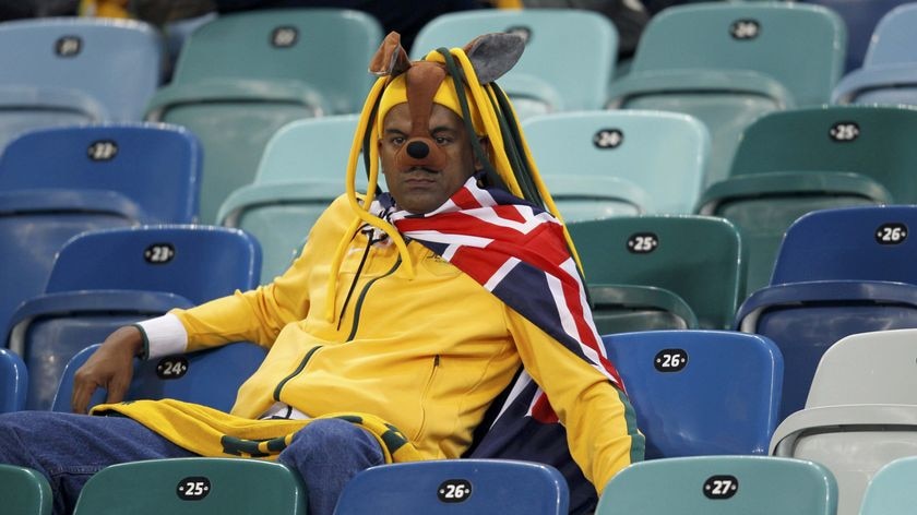 Durban disaster: Socceroos fan cuts a forlorn figure at Moses Mabhida Stadium.
