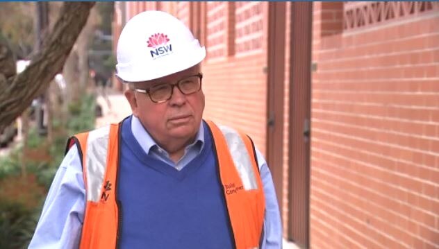 a man wearing a hard hat looking