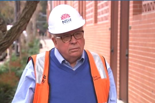 a man wearing a hard hat looking