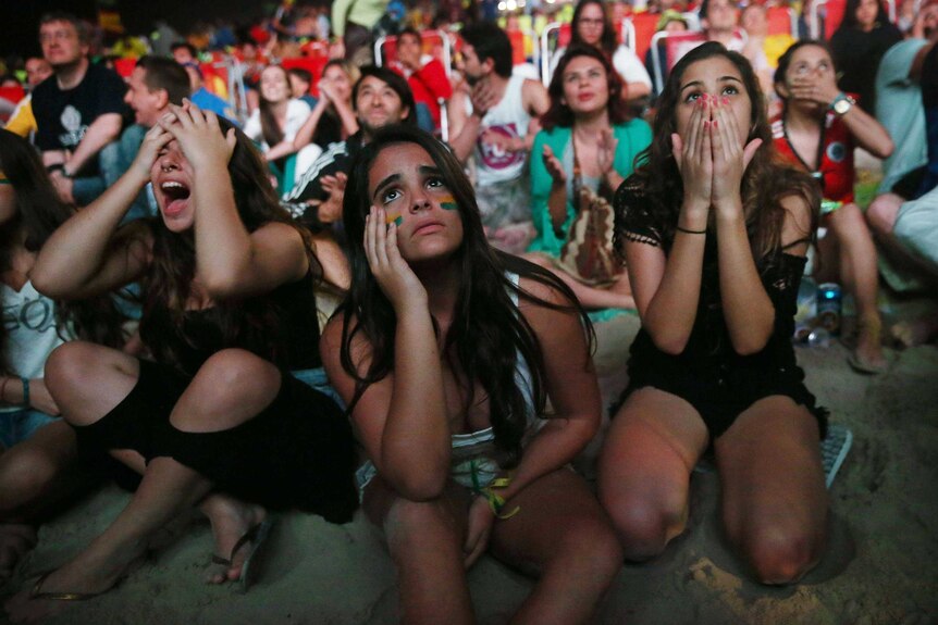 Brazil fans at Copacabana Beach react after the Netherlands make it 3-0 in World Cup playoff.