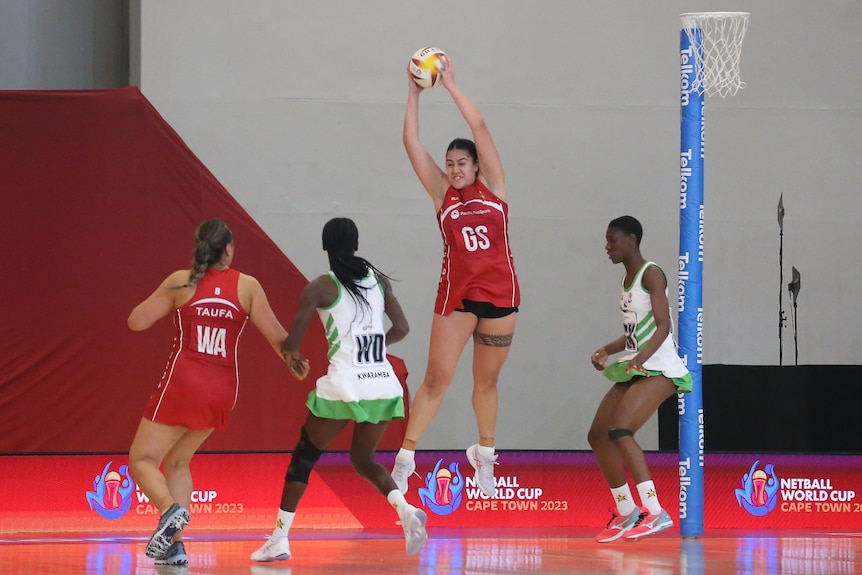 Uneeq Palavi sails through the air as she takes the ball for Tonga at the Netball World Cup