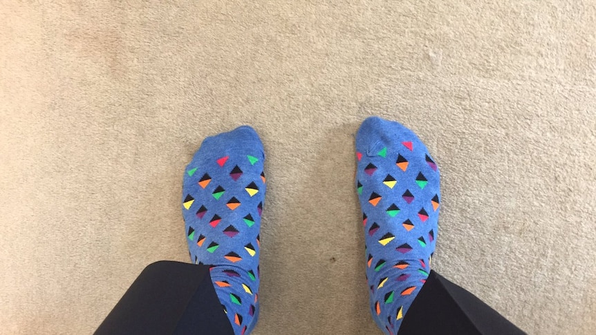 A man posts a photo of his shoeless feet on social media.