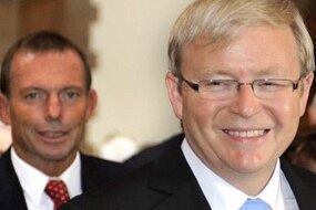 File photo: LtoR Opposition Leader Tony Abbott follows Prime Minister Kevin Rudd (AAP: Alan Porritt)