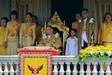 Thai King Bhumibol Adulyadej (C) surrounded by his family