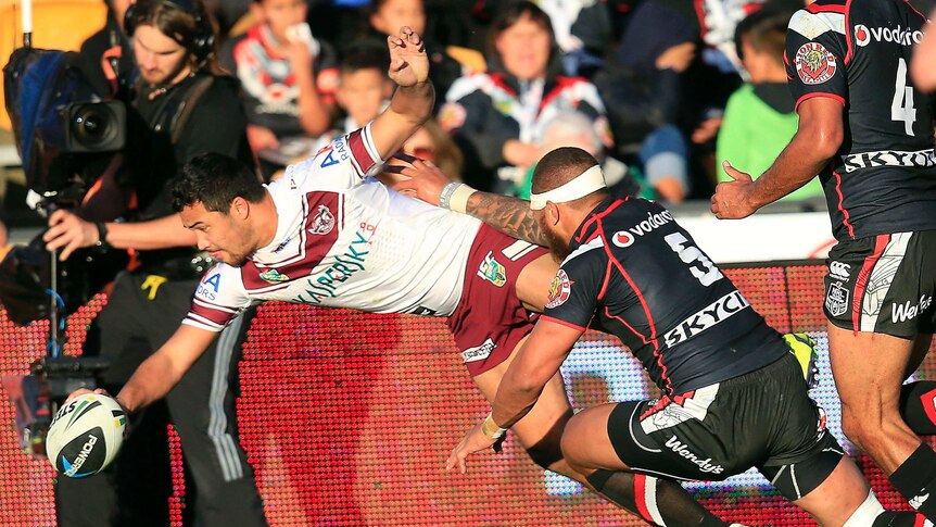 Touching down ... Peta Hiku scores in the corner for Manly