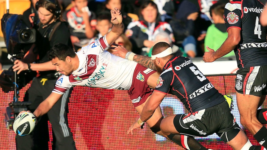 Touching down ... Peta Hiku scores in the corner for Manly